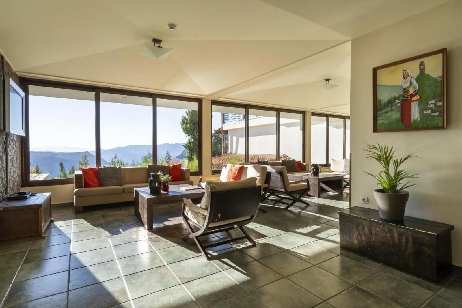 Lounge with wide windows looking over the mountain landscape