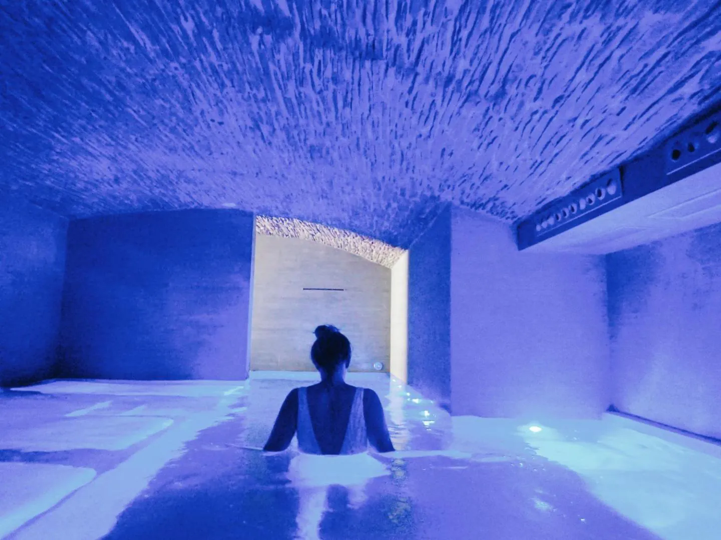 Heated indoor pool in the wellness centre at Barceló Teguise Beach, under a blue-lit vaulted ceiling