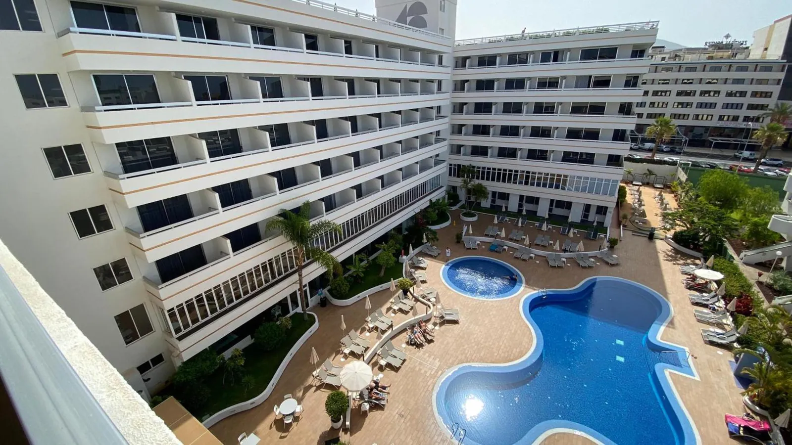 Aerial view of the hotel with its curving pool