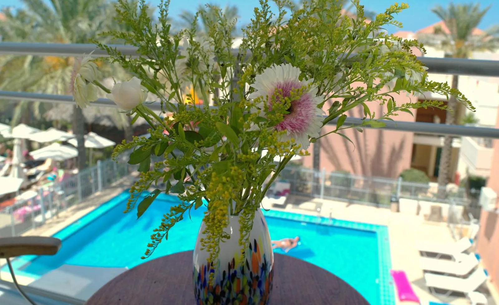 View down onto the pool from a balcony at Kallitsakis Beach