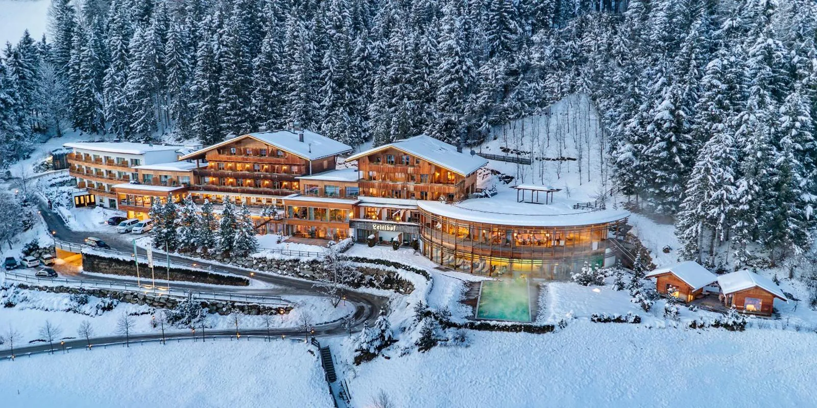 Naturhotel Leitlhof above San Candido under snow, seen from the air