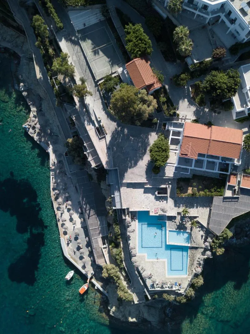 Two-level saltwater pool on the rocky tip of the peninsula, seen from above, with the sea all around