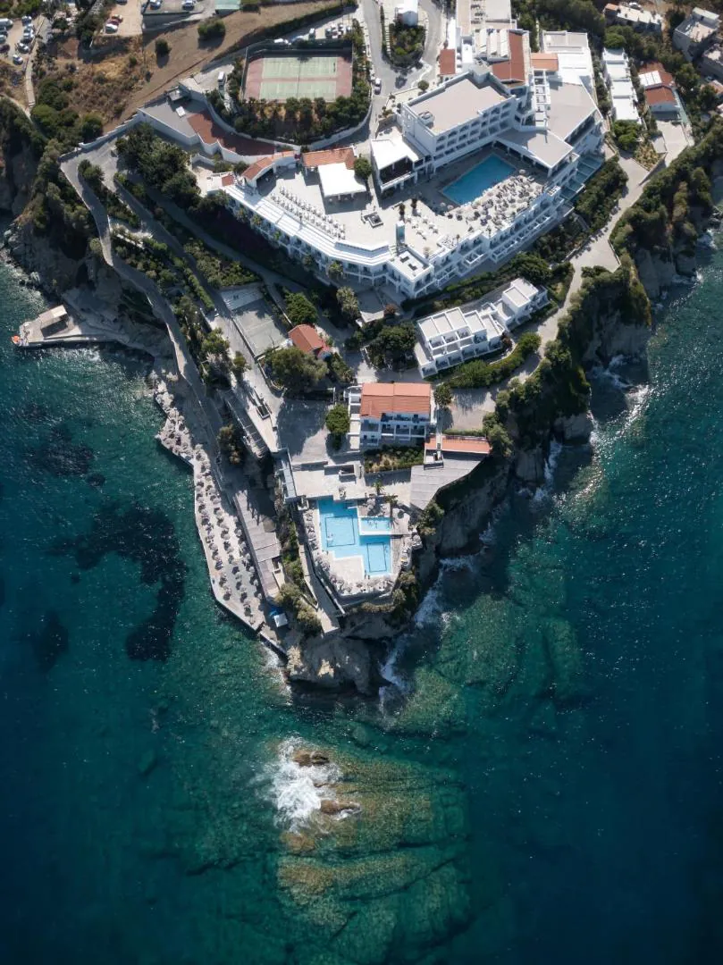 Aerial view of the resort with the main pool by the hotel and the saltwater pool at the point