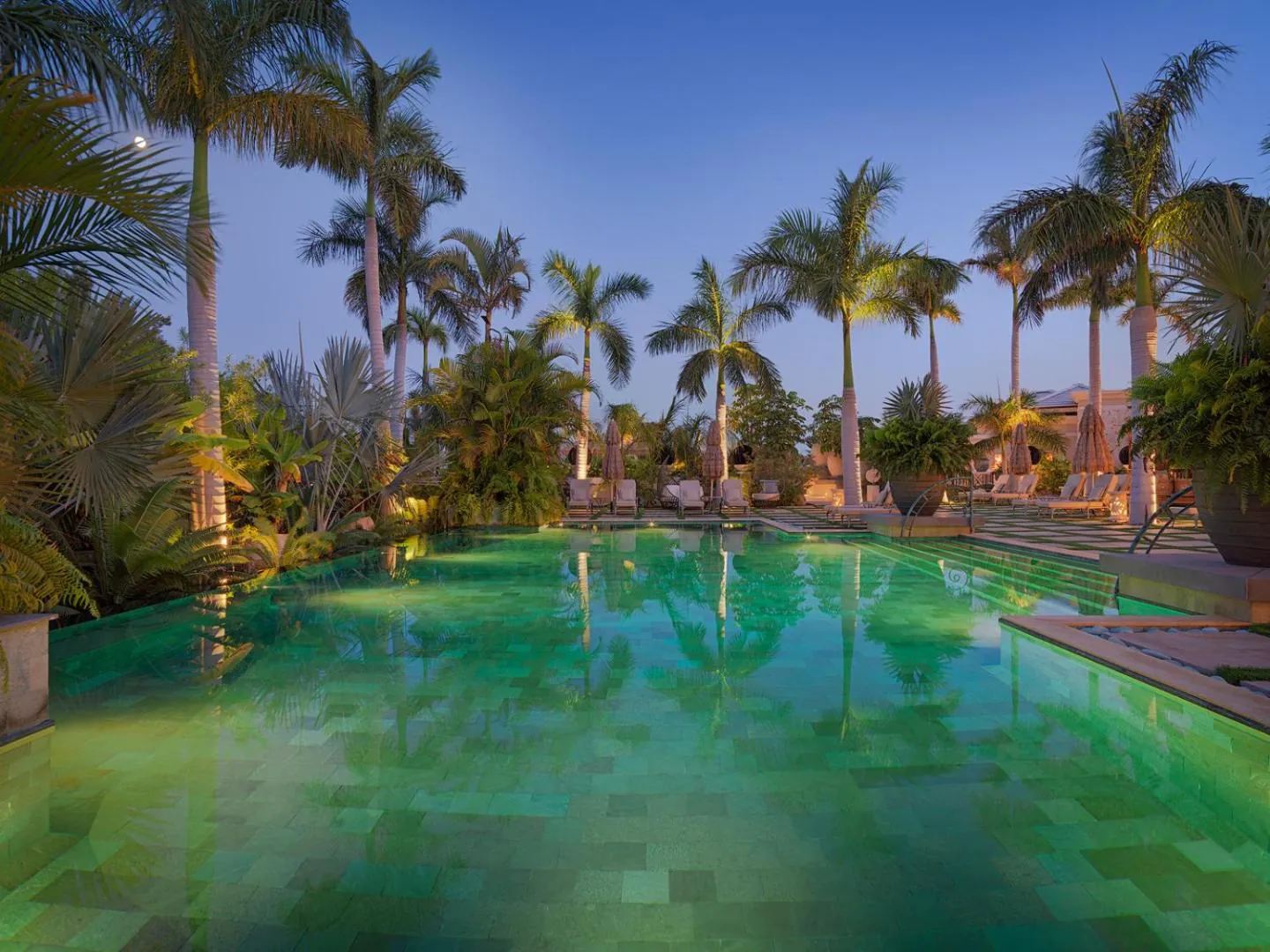 Lagoon pool under palms at dusk at Royal River, Costa Adeje