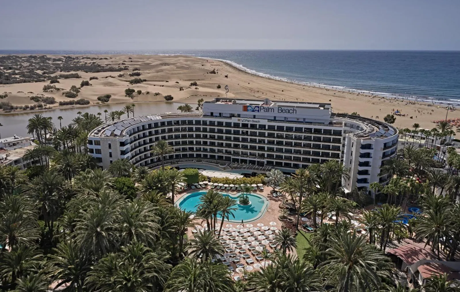 Seaside Palm Beach from the air, with the Maspalomas dunes and the sea beyond