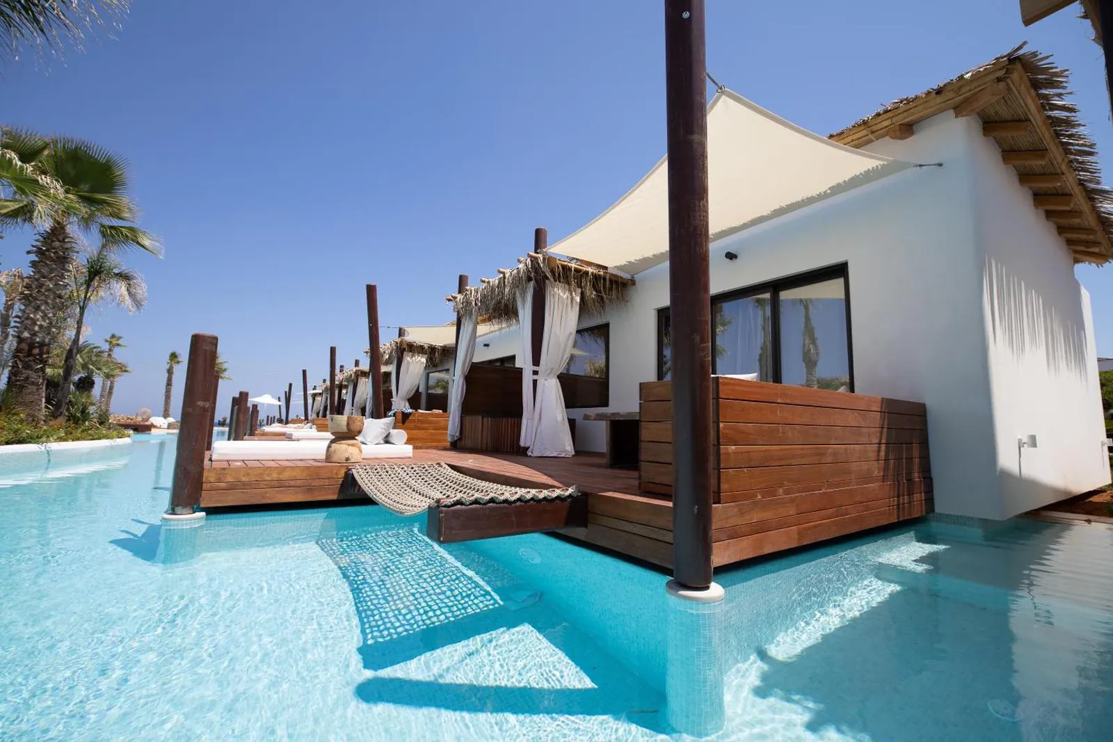 Bungalow terrace with steps straight down into the lagoon pool