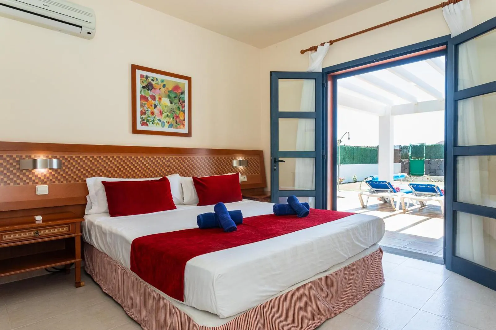 Double bedroom with doors opening straight onto the pool terrace