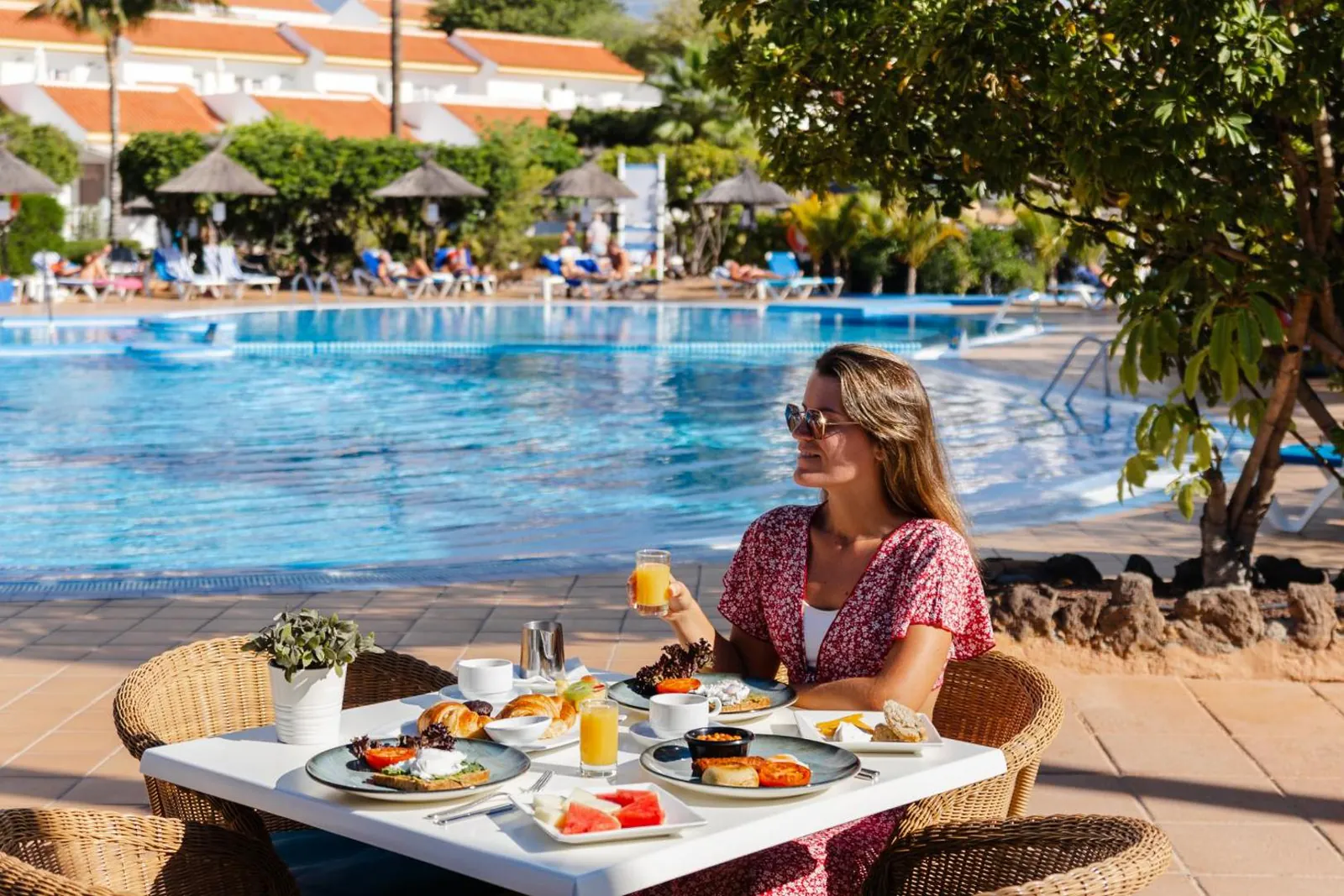 Breakfast at a table beside the pool